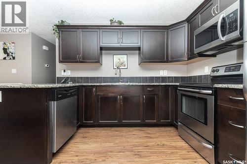 118 125 Willis Crescent, Saskatoon, SK - Indoor Photo Showing Kitchen With Stainless Steel Kitchen