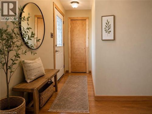 Entryway featuring a decorative transom door, wood-finish flooring, and natural wood trim - 274 East 38Th Street, Hamilton, ON - Indoor Photo Showing Other Room