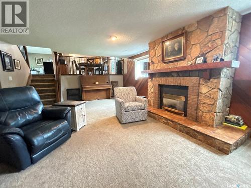 205 Schaefer Street, Richmound, SK - Indoor Photo Showing Living Room With Fireplace