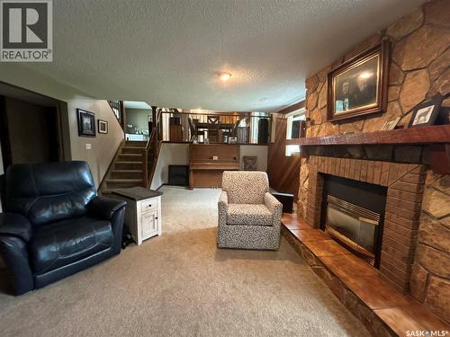205 Schaefer Street, Richmound, SK - Indoor Photo Showing Living Room With Fireplace