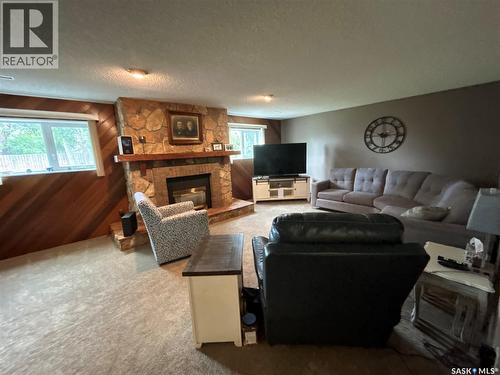 205 Schaefer Street, Richmound, SK - Indoor Photo Showing Living Room With Fireplace