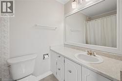 Bathroom vanity with an integrated sink, framed mirror, and decorative wall paneling - 