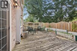 Expansive wood deck with a privacy fence - 