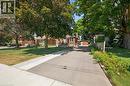 Long asphalt driveway leading to a detached garage - 714 Frederick Street, Kitchener, ON  - Outdoor 