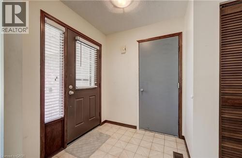 Tiled foyer and entry to garage. - 197 Southwood Drive, Kitchener, ON - Indoor Photo Showing Other Room