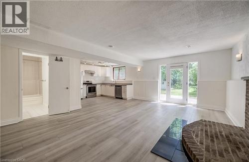 Laminate flooring throughout lower level. - 197 Southwood Drive, Kitchener, ON - Indoor With Fireplace