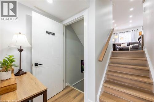 Staircase featuring wood-finish treads and a natural wood handrail - 185 Highland Crescent Unit# 2, Kitchener, ON - Indoor Photo Showing Other Room