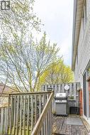 Wood deck with railing and privacy fencing - 