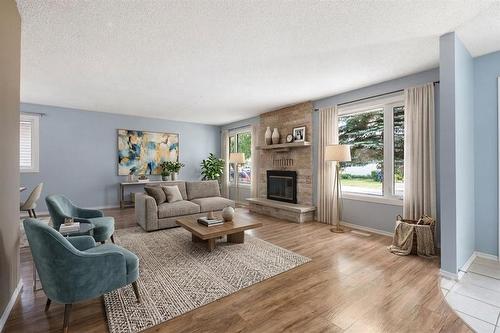 50 Kowall Bay, Winnipeg, MB - Indoor Photo Showing Living Room With Fireplace
