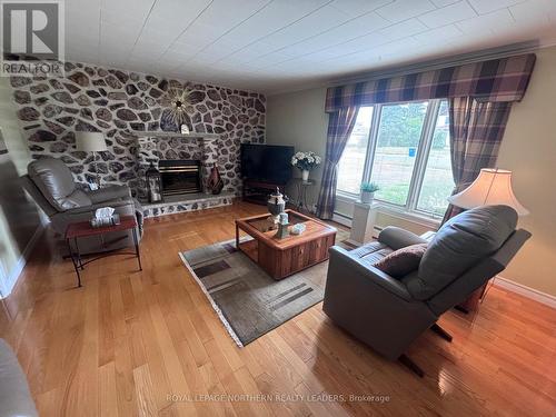324 Third Avenue, Cochrane, ON - Indoor Photo Showing Living Room With Fireplace