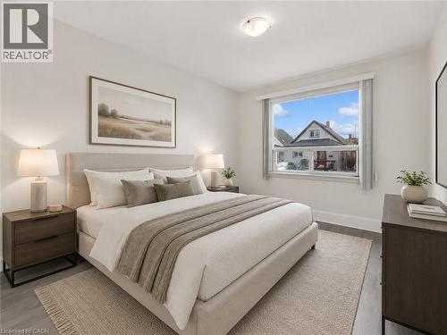 Virtually Staged Bedroom 1 - 29 Harrison Avenue, Hamilton, ON - Indoor Photo Showing Bedroom