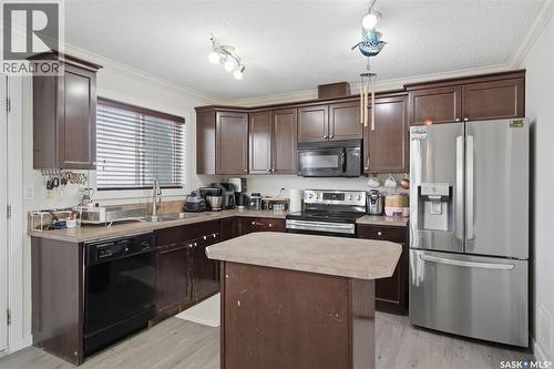 70 235 Rosewood Boulevard E, Saskatoon, SK - Indoor Photo Showing Kitchen With Double Sink