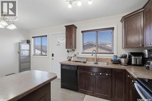 70 235 Rosewood Boulevard E, Saskatoon, SK - Indoor Photo Showing Kitchen With Double Sink