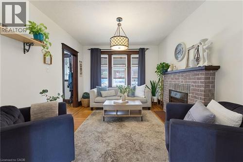 394 Charlton Avenue W, Hamilton, ON - Indoor Photo Showing Living Room With Fireplace