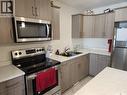 #212 315 Dickson Crescent, Saskatoon, SK  - Indoor Photo Showing Kitchen With Double Sink 