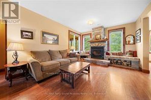 25 Cole Point Trail, Mckellar, ON - Indoor Photo Showing Living Room With Fireplace