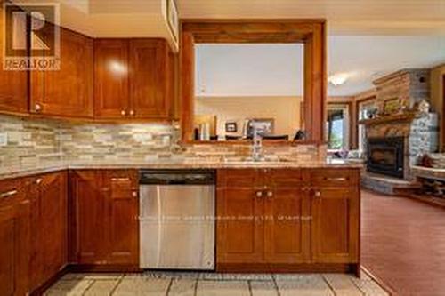 25 Cole Point Trail, Mckellar, ON - Indoor Photo Showing Kitchen With Fireplace