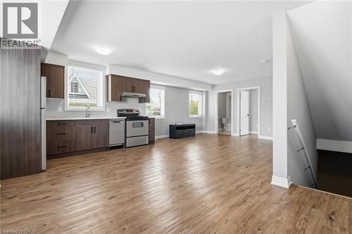 Open-concept living area featuring wood-finish flooring throughout - 5 Hagar Street, Thorold, ON - Indoor Photo Showing Kitchen