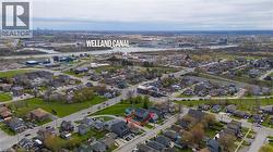 Aerial perspective showcasing the residential streetscape and surrounding infrastructure - 