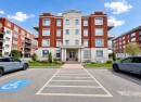 Façade - 403-110 Rue Barnett, Dollard-Des-Ormeaux, QC  - Outdoor With Balcony With Facade 