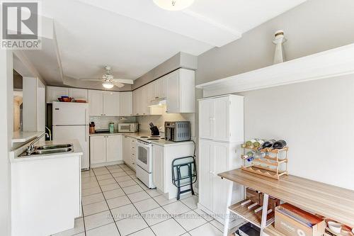 White Cabinets&appliances - 331 Ravineview Way, Oakville, ON - Indoor Photo Showing Kitchen With Double Sink
