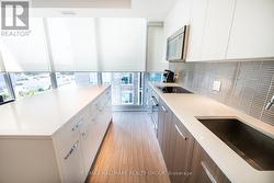 Kitchen w/Quartz Counters & European Appliances - 