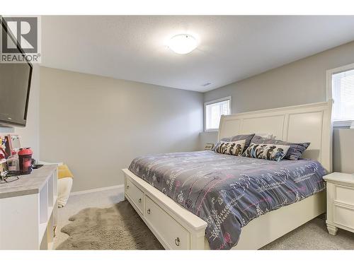 Third bedroom on lower level - 133 Wyndham Crescent Unit# 110, Kelowna, BC - Indoor Photo Showing Bedroom