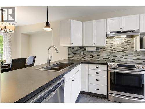 Kitchen to Dining - 133 Wyndham Crescent Unit# 110, Kelowna, BC - Indoor Photo Showing Kitchen With Double Sink
