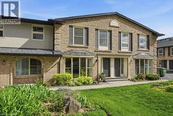 Brick exterior featuring a gabled roofline - 