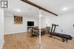Finished lower level featuring cork flooring, recessed lighting, and white walls - 