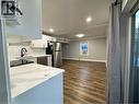 Contemporary kitchen featuring white cabinetry, quartz countertops, a subway tile backsplash, and stainless steel appliances - 773 Lawrence Road, Hamilton, ON  - Indoor 
