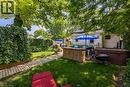Expansive backyard featuring a manicured lawn and mature trees - 5 Hawthorne Avenue, Simcoe, ON  - Outdoor With Backyard 