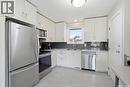 38 Cartier Crescent, Saskatoon, SK  - Indoor Photo Showing Kitchen With Double Sink 