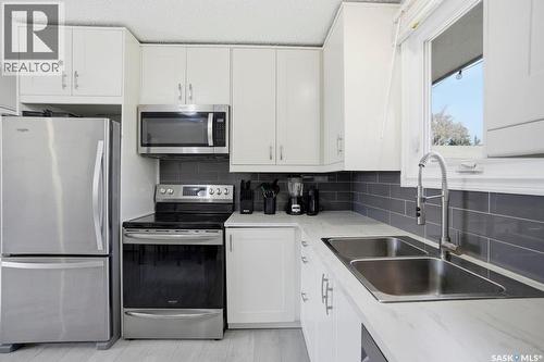 38 Cartier Crescent, Saskatoon, SK - Indoor Photo Showing Kitchen With Double Sink