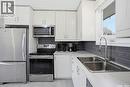38 Cartier Crescent, Saskatoon, SK  - Indoor Photo Showing Kitchen With Double Sink 