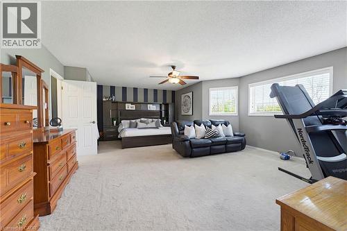 Spacious bedroom featuring light neutral carpeting and gray wall paint - 29 Watson Crescent, Ayr, ON - Indoor Photo Showing Other Room