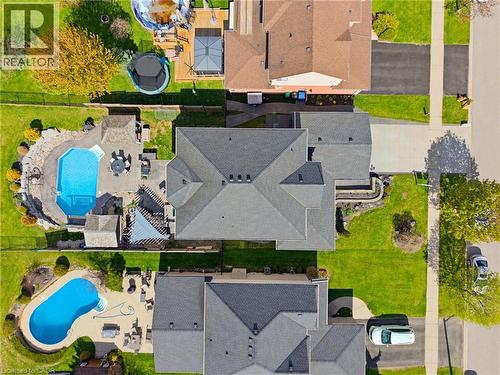 Expansive backyard oasis featuring an in-ground swimming pool, large paver patio, and covered pergola - 29 Watson Crescent, Ayr, ON - Outdoor With In Ground Pool With View