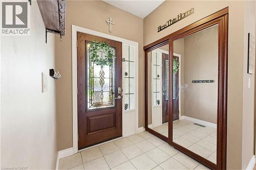 Entryway featuring a wood-panel door with leaded glass, sidelight, and transom window - 29 Watson Crescent, Ayr, ON - Indoor Photo Showing Other Room