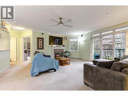 307 Whitman Road Unit# 206, Kelowna, BC - Indoor Photo Showing Living Room With Fireplace