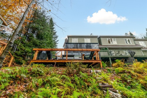 Back of Structure - 87 Ch. Des Couleurs, Saint-Sauveur, QC - Outdoor With Deck Patio Veranda