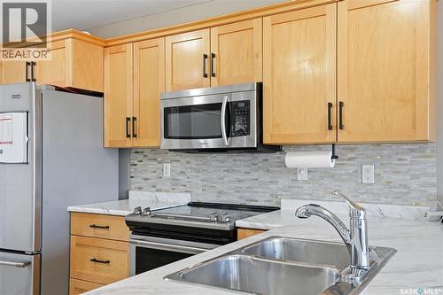 20 515 Centennial Drive, Warman, SK - Indoor Photo Showing Kitchen With Stainless Steel Kitchen With Double Sink