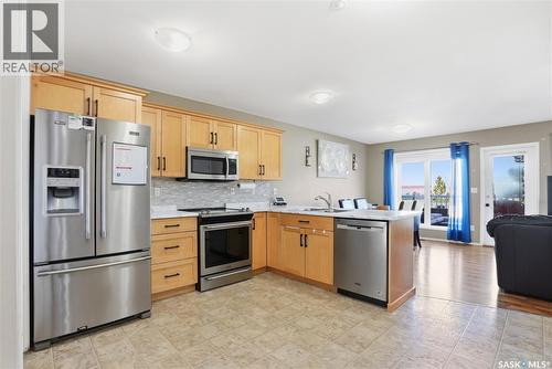 20 515 Centennial Drive, Warman, SK - Indoor Photo Showing Kitchen With Stainless Steel Kitchen With Double Sink