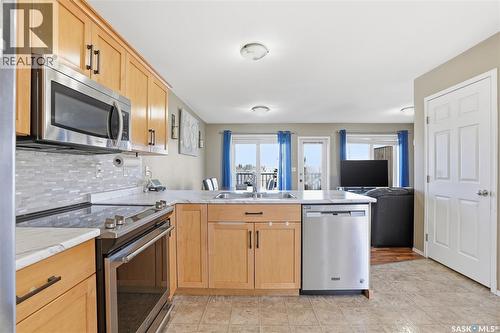 20 515 Centennial Drive, Warman, SK - Indoor Photo Showing Kitchen With Stainless Steel Kitchen With Double Sink