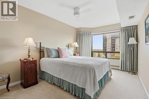 Bedroom featuring a full-height window, ceiling fan, and neutral wall paint - 10 Ellen Street E Unit# 808, Kitchener, ON - Indoor Photo Showing Bedroom