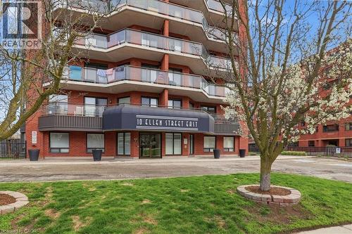 Red brick high-rise building with extensive glass-paneled balconies - 10 Ellen Street E Unit# 808, Kitchener, ON - Outdoor