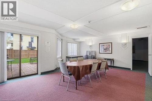 Spacious room featuring broadloom carpeting, ceiling lighting, and multiple windows - 10 Ellen Street E Unit# 808, Kitchener, ON - Indoor Photo Showing Dining Room