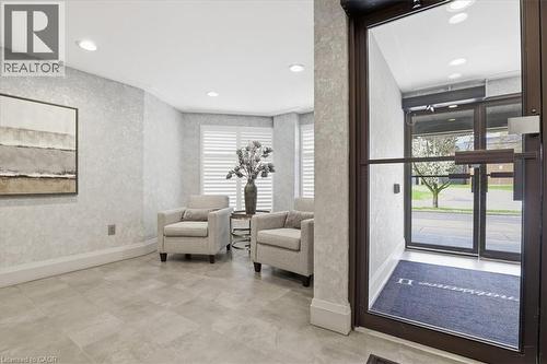 Entryway featuring durable tile flooring, recessed lighting, textured wall finishes, and a glass-paneled entry door - 10 Ellen Street E Unit# 808, Kitchener, ON - Indoor Photo Showing Other Room