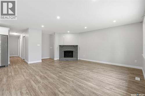 6602 Collins Bay, Regina, SK - Indoor With Fireplace