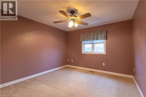 Bedroom featuring warm-toned walls, a ceiling fan with integrated lighting, and a single window - 4066 Medland Drive, Burlington, ON - Indoor Photo Showing Other Room