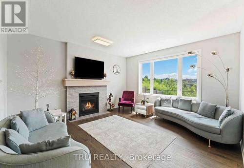 43 Aridus Crescent, Ottawa, ON - Indoor Photo Showing Living Room With Fireplace